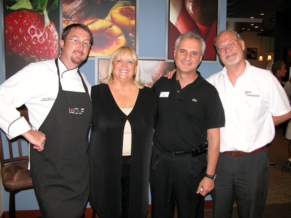 Will Ratley, corporate executive chef with the Westye Group Southeast Inc., with hosts Linda Roberts, Eugene Tsikis and Greg Dryjanski, all of the House of Appliances. Ratley prepared the appetizers for the event using the store's "living kitchen."