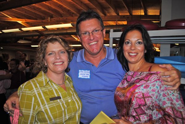 Phyllis Sica, owner of host Gym 111, left, with Larry Gautier of the Orange Bowl Football Committee and Tania Agran of Farmer's Fresh Raw & Vegan Homemade Meals. 
