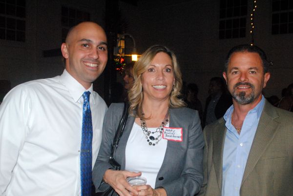 David Fialko, left, and Mary Boutin, both of BankUnited, with Stuart Pisarra of Furniture Doctor.