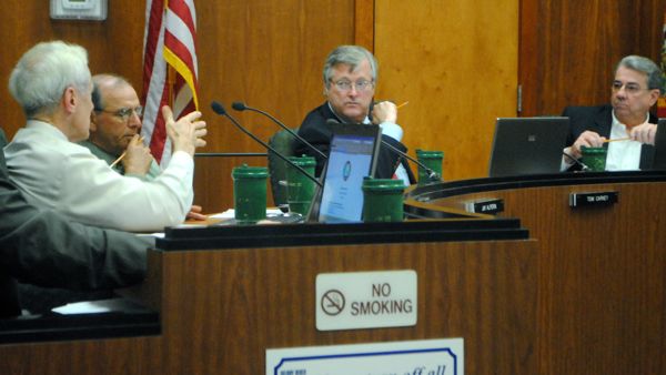 City Manager David Harden, left, proposes using reserves to fill a $3.2 million hole in the budget created when Delray commissioners decided not to go forward with a fire service fee. Also shown, commissioners Jay Alperin and Tom Carney and Mayor Woodie McDuffie. 