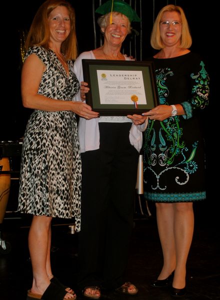 Alberta Gaum-Rickard, center, receives her certificate from Tami Lustig of the Delray Beach Chamber of Commerce and Chamber Chairwoman Kimberly Camejo. 