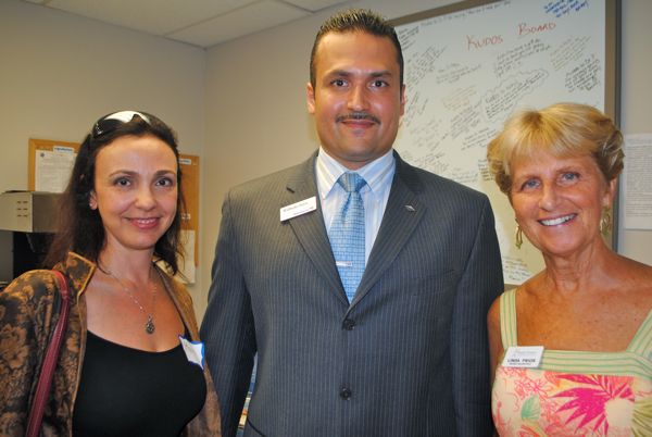 Maya Karkisyan of Transentient in Boca Raton, left, with Wilfredo Ortiz of Bank of America's West Atlantic office in Delray Beach and Linda Prior of Family Promise of South Palm Beach County. 