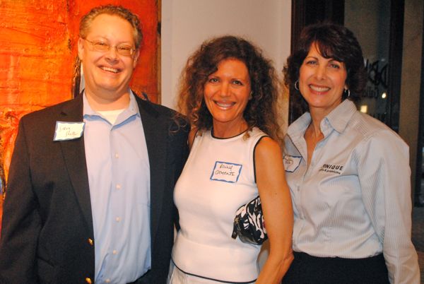 Steve Shelby of FarVision Networks, left, with Ronna Clements, a natural health practioner, and Ami Zak of Unique Gifts and Premiums. 