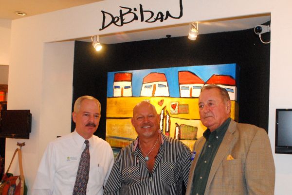 John Campanola of New York Life, left, with host William DeBilzan and Edward Boyd of Benefit Specialists Inc. 
