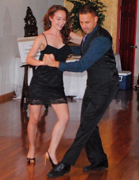 Daryl Philibert, a dance instructor, and Laura Buchbinder demonstrate the salsa. 