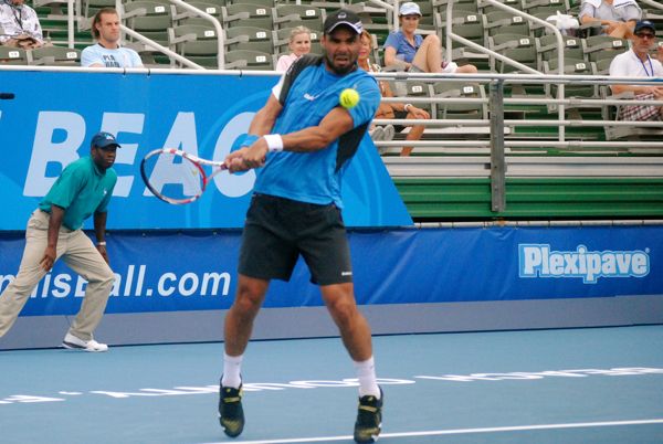 Alejandro Falla of Colombia backhands against Querrey Monday afternoon. 