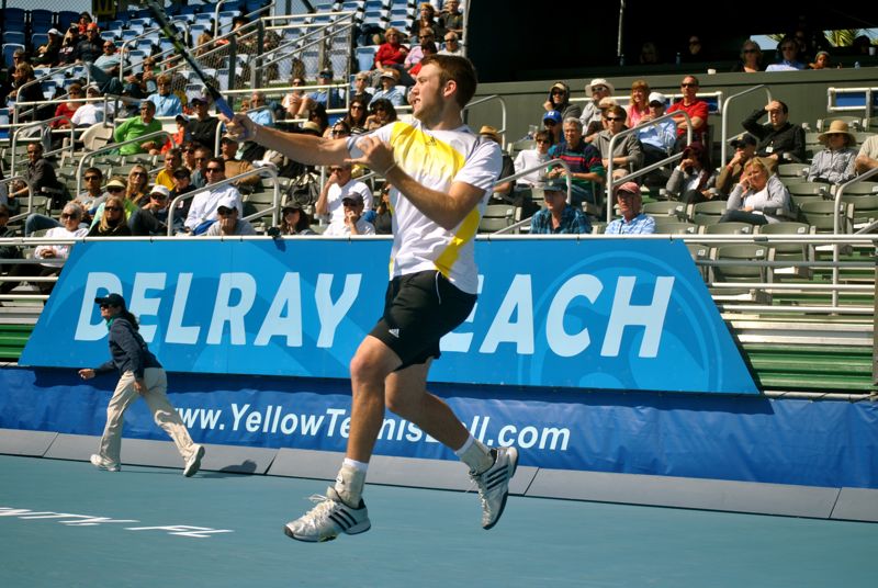 Jack Sock returns serve in the second set of the doubles final Sunday at the Delray Beach International Tennis Champsionships.